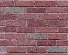 a red brick wall that is very close to the ground