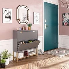 a room with pink walls and green doors