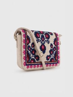 YASMINE SLING BAG – BEIGEHandcrafted Embroidered Sling Bag from India - Stylish and Artfully Designed.Elevate your style with Beige Base Sling Bag featuring intricate Blue Wool Embroidery. This Boho Chic Crossbody Bag combines practicality with a unique Artisan Design. Stand out elegantly with this Floral Embroidered Handbag, perfect for any adventure.- Material: Cotton Canvas (Embroidered)- Dimensions: (H) 6.5“x (W) 10“x (D) 2“- Bag Height including Handle = 29“- Handle Drop = 22.5" (Adjustable Bohemian Beige Shoulder Bag With Floral Embroidery, Multicolor Embroidered Crossbody Shoulder Bag With Adjustable Strap, Multicolor Embroidered Woven Motifs Shoulder Bag For Everyday Use, Multicolor Embroidered Shoulder Bag For Everyday Use, Multicolor Embroidered Floral Crossbody Shoulder Bag, Multicolor Embroidered Crossbody Bag, Multicolor Embroidery Crossbody Shoulder Bag, Multicolor Floral Embroidery Crossbody Shoulder Bag, Bohemian Crossbody Bag With Floral Embroidery