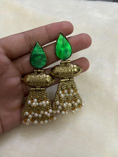 Beautiful Premium Quality Emerald Earrings *For More Beautiful Collection, Check At https://www.etsy.com/shop/placeoffashion *Necklace Fitting Is Adjustable *Earring Closure: Push Back **Necklace Closure : Beautiful Silk Thread *It is a Bridal or Partywear Set. *It Will Give You a Unique and Beautiful Look  *You Can Wear This Beautiful Set At Dress or Saaree  *The Colour Combination Of This Set Is Very Unique , It can go With Any Of The Outfit *It Gives You a Unique Look For Your Special Events Unique Metal Earrings For Festive Occasions, Traditional Metal Plug Earrings For Party, Unique Festive Metal Earrings, Traditional Green Beaded Earrings For Party, Handmade Festive Dangle Pearl Earrings, Traditional Green Beaded Party Earrings, Festive Handmade Dangle Pearl Earrings, Fusion Style Pearl Earrings With Latkans For Celebrations, Traditional Metal Earrings With Pearl Drop