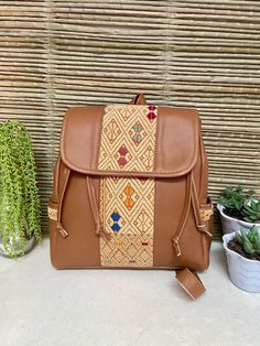 "This Mexican backpack is a perfect accessory for any occasion. Each backpack is a unique piece embroidered with bright colors and a very bohemian style. Each of our pieces is carefully crafted by artisans from the states of Oaxaca and Chiapas. Our items are made of cotton. We ship anywhere in the world, from Tepic, Nayarit, mx. Care instructions: Take care to hand wash your items in cold water and hang them to dry. Measurement in inches width 11\" high 12\" depth 5\"" Bohemian Backpack For Festivals, Bohemian Rectangular Backpack For Festivals, Embroidered Shoulder Backpack For Daily Use, Bohemian Brown Backpack, Bohemian Brown School Bag, Bohemian Style Brown Backpack, Brown Bohemian School Bags, Bohemian Brown Standard Backpack, Bohemian Handmade Backpack