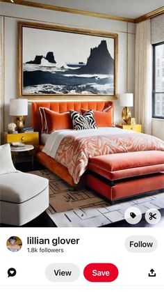 an orange and white bed in a bedroom with pictures on the wall above it, along with other furniture