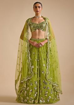 Elevate your wardrobe with stunning Lime Green Embroidered Lehenga. Crafted from premium soft net fabric, this lightweight lehenga dazzles with intricate sequin and mirror patra embroidery in captivating floral patterns. Paired with an embroidered blouse and completed with a scalloped dupatta. Ideal for making a statement at Mehendi and Sangeet ceremonies or as a standout wedding guest outfit. Composition : Lehenga, Blouse and Dupatta - Net Care: Dry Clean Only and Vacuum Storage This product ca Lightweight Lehenga, Scalloped Dupatta, Neeta Lulla, Set Saree, Saree Gown, Vacuum Storage, Embroidered Lehenga, Indian Wedding Wear, Lehenga Blouse