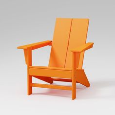 an orange wooden chair sitting on top of a white floor