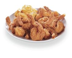 fried chicken and potatoes on a white plate