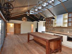 an image of a kitchen being remodeled with wood flooring