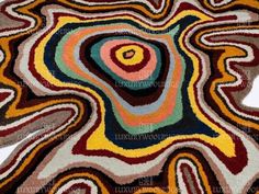 an abstract rug with various colors and shapes