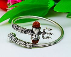 Vintage antique design handmade 925 sterling silver amazing rudraksha beads bahubali shiva trident trishool kada bangle bracelet, excellent gifting jewelry from Rajasthan India. Metal-925 Sterling silver. Item type-Bangle/Bracelet/kada Weight-22.590 grams approx. Width-3.5.mm bangle size Stamped-925. Size-Select your size from option finish-Oxidized. Excellent gifting jewelry Silver Bangle For Puja, Adjustable Silver Jewelry For Puja, Symbolic Jewelry For Navratri Puja, Symbolic Jewelry For Navratri Rituals, Symbolic Jewelry For Puja And Navratri, Spiritual Bangle For Puja, Adjustable Spiritual Jewelry For Diwali, Symbolic Oxidized Jewelry For Festivals, Silver Symbolic Jewelry For Diwali