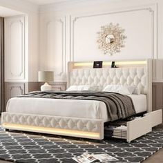 a white bed sitting in a bedroom on top of a rug