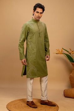 Green kurta with quilted embroidery on left and right side. Paired with a cotton silk churidar. - Aza Fashions Fitted Cotton Silk Kurta For Ceremonial Occasions, Ceremonial Cotton Silk Fitted Kurta, Fitted Cotton Sherwani With Floral Embroidery, Festive Cotton Sherwani With Floral Embroidery, Ceremonial Cotton Sherwani With Cutdana, Cotton Sherwani With Floral Embroidery For Diwali, Traditional Fit Cotton Sherwani With Cutdana, Cotton Sherwani With Cutdana In Traditional Fit, Cotton Sherwani With Chikankari Embroidery In Traditional Fit