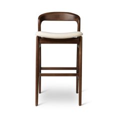 a wooden bar stool with a white seat pad on the top and backrests