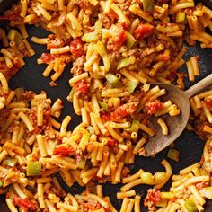 a skillet filled with pasta and vegetables