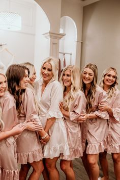 bridesmaids in pink robes posing for the camera with text overlay that reads robes for every bridesmaid