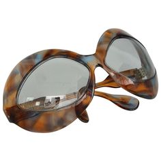 Pierre Marly cocktail sunglasses with a futuristic, avant-garde, oversized tortoiseshell frame. Made In France. Measures: Hinge to hinge 5.25" Eye frame height 2.69" Arm length 4". Modern Tortoiseshell Glass Sunglasses, Big Sunglasses Women, 1960s Sunglasses, Translucent Sunglasses, 60s Jewelry, Funky Glasses, Sunglasses Oversized, Big Sunglasses, Big Jewelry