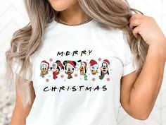 Merry Christmas Tee, Disneyworld Friends Mickey And Minnie Tshirt Gift, Christmas Shirts For Best Friends, Holiday Shirt, Friends Xmas Gift Welcome to CrystalThreadsUS. You are at the address where you can find special and beautiful products that suit your style. Take a look at our wide collection that we have carefully selected for you and discover your favorite piece. We wish you pleasant shopping! PRODUCTS Tees are Unisex, classic fit. Please refer to size chart in listing photos for details.  For printing, we use Bella Canvas and Gildan SoftStyle brand shirts, which are the best in the industry. *Bella Canvas -unisex size -4.2 oz. -Solid colors are 100% Combed Cotton and Ring-Spun Cotton. -Athletic Heather 90% Combed and Ring-Spun Cotton, 10% Polyester -All Heather CVC Colors 52% Combe Best Friends Holiday, Shirts For Best Friends, Minnie Tshirt, Shopping Products, Friends Holiday, Types Of T Shirts, Brand Shirts, Holiday Shirt, Mickey And Minnie