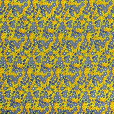 a yellow and blue background with small dots