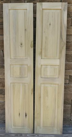 two wooden doors sitting next to each other