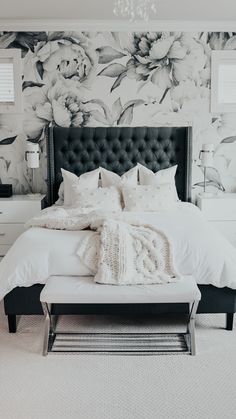 black and white bedroom with floral wallpaper