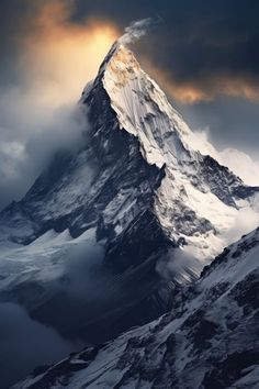 a very tall snow covered mountain with clouds in the sky over it's summit