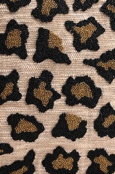 an animal print fabric with gold and black details