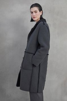 This coat features a button front, lapel, and side seam patch pockets, with a cozy faux sherpa interior and trims for added warmth. Shearling Outerwear With Pockets For Work, Long Fur Coat With Pockets For Work, Shearling Long Coat For Work, Velvet Tees, Cami Shirt, Linen Shop, A Button, Sweater Sale, Romper Dress