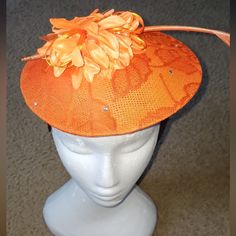 2 Orange Fascinator Styles With Gems And Feathers Spring Formal Fitted Mini Hats, Spring Fitted Mini Hat Headband, Fitted Orange Hats For Spring, Spring Formal Fitted Fascinator, Spring Event Fascinator, Orange Spring Evening Fascinator, Spring Evening Orange Fascinator, Adjustable Orange Fascinator For Evening, Fitted Orange Mini Hats For Kentucky Derby