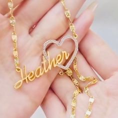 Show your love and appreciation with this stunning custom heart name pendant. This pendant features a two tone design of 10k vermeil gold and sterling silver, creating a beautiful contrast and a unique look. The pendant is shaped like a heart, with a cut-out of your chosen name in the center. The name is also plated with 10k vermeil gold, adding a touch of elegance and sparkle. The pendant comes with a 10k gold 18 inch matching chain, making it ready to wear or gift. This pendant is a perfect wa Gold Nameplate Heart Necklace For Gift, Customized Gold Heart Necklace For Mother's Day, Gold Heart Necklace With Custom Name, Gold Heart Necklace With Custom Name For Gift, Gold Heart Necklace With Name For Anniversary, Gold Heart Necklace For Anniversary Gift, Personalized Name Pendant Necklace For Valentine's Day, Personalized Name Necklace For Valentine's Day, Valentine's Day Personalized Pendant Name Necklace