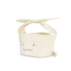 a white bag with a cat face on the front and a bow at the top