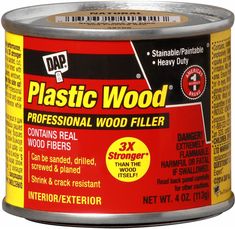 a can of plastic wood filler on a white background