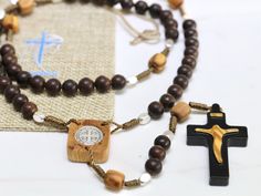 "Wooden rosary, handmade St Benedict medal rosary, risen Christ crucifix , Ebony and olive wood rosary, Medjugorje rosary, black rosary beads This wooden rosary is made with ebony and olive wood components with silver Saint Benedict medal. Size of ebony beads is 8 mm and is used to make decades of rosary while olive wood is used for \" Our Father bead \" and use of it is 8x10 mm. Cross and centerpiece is made with olive wood where cross is additionally colored in black on edges with creating sha Handmade Brown Crucifix Rosary, Risen Christ, Black Rosary, Wooden Rosary, Saint Benedict Medal, St Benedict Medal, Benedict Medal, Christ Is Risen, Saint Benedict