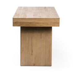 a small wooden table sitting on top of a white surface with no one around it