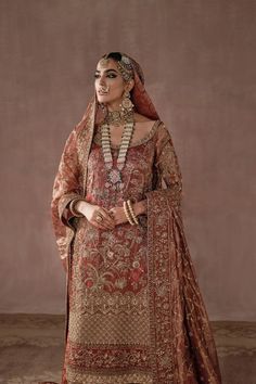 Royal Heavily Embellished Pakistani Bridal Dress Red Gold Farshi Gharara is further beautified with a heavily worked silk tissue dupatta with beautiful borders and a classic jaal created using pitta technique of embroidery. Regality knows no bounds in this grand and magical piece. भारतीय दुल्हन संबंधी, Desi Couture, डिजाइनर कपड़े, Latest Bridal Lehenga Designs, Bridal Mehndi Dresses, Pakistani Bridal Dress, Red Bridal Dress, Bridal Lehenga Designs, Mehndi Dress