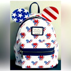 Nwt Disney Loungefly Mini Backpack Featuring An Americana Patriotic Red White And Blue Stars And Stripes Theme With Mickey And Minnie Head Icons. Perfect Condition. Pet Free And Smoke Free Environment Backpack With Pins, Lounge Fly, Mickey Backpack, Loungefly Purse, Disney Backpack, Loungefly Mini Backpack, Dumbo The Flying Elephant, Disney Purse, Disney Loungefly