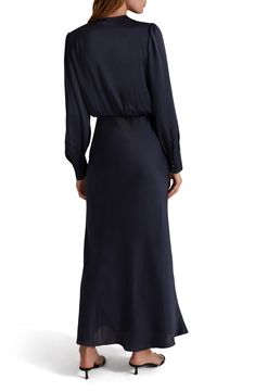 Elevate your look in this slinky satin maxi dress designed with a drapey, pleated surplice V-neck and long sleeves with button cuffs. 58" length (size Medium) Surplice V-neck Long sleeves with button cuffs Partially lined 100% polyester Dry clean or hand wash, dry flat Imported Long Sleeve Maxi Dress With Draped Sleeves For Work, Elegant Long Sleeve Viscose Maxi Dress, Formal Long Sleeve Maxi Dress With Draped Sleeves, Elegant Maxi Dress With Button Cuffs, Long Sleeve Silk Satin Dress For Work, Long Sleeve Satin Silk Dress For Work, Satin Long Sleeve Silk Dress For Work, Formal Fall Maxi Dress With Draped Sleeves, Elegant Maxi Dress With Button Cuffs For Formal Occasions