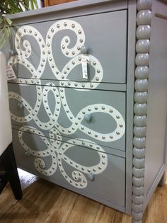 a dresser with an octopus design painted on it