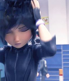 a girl with black hair is holding her hands up to her head