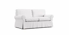 a white couch with two pillows on it