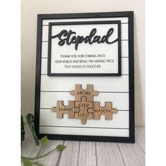 a wooden puzzle frame with the words step dad on it