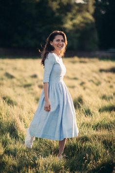 1950's Dress, Boho Wedding Dress, Blue Linen Dress❃ The power of a beautiful dress is not to be underestimated. The right dress can transform your confidence and break hearts from across the room. Unlock that power with this simply beautiful 1950s dress.❃ Not every bride has to wear white on her wedding day. This 50’s inspired retro-chic wedding dress is sky blue! The dress style of the 50s is incomparable to any other decade. This elegant dress is perfect for your not so traditional wedding day Blue Full Skirt Dress For Wedding, Blue Vintage Dress For Spring Wedding, 1950s Style Blue Wedding Dress, Modest Blue Wedding Dress, Light Blue Fitted Midi Dress For Wedding, Fitted Light Blue Midi Dress For Wedding, Fitted Blue Vintage Dress For Wedding, 1950s Style Spring Wedding Dresses, Vintage Midi Wedding Dress With Fitted Bodice