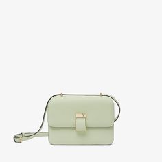 Named after the emerging cultural hotspot in Milan, the NoLo handbag is an ode to the energy of our hometown. This mini version arrives in our signature Millepunte calf skin, its multidimensionality heightened by its striking mint green hue. Inspired by our archive, its lock has a distinctive asymmetrical V-cutout with a magnet concealed behind it. With one central compartment for everyday essentials and an external pocket for easy access to regularly used items. Green Square Flap Bag In Modern Style, Green Square Flap Bag Modern Style, Modern Green Square Flap Bag, Modern Square Green Flap Bag, Modern Green Flap Bag For Everyday, Modern Green Flap Bag With Detachable Handle, Modern Green Leather Flap Bag, Modern Green Box Bag With Detachable Strap, Modern Green Top Handle Shoulder Bag