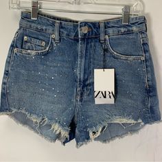 Zara Denim Distressed Embellished High Waisted Shorts Raw Hem New With Tag Size 2 Waist 13.5 Inch Hip 17.5 Inch Tags Festival Summer Beach Concert Bling Bling Y2k Rhinestones Spring High Waist Embellished Jeans, High-waist Embellished Jeans For Spring, Denim Blue Embellished Bottoms, Trendy Embellished Denim Blue Bottoms, Embellished Denim Blue Denim Bottoms, Trendy High Waist Embellished Bottoms, Trendy High Waisted Embellished Bottoms, Mid-rise Embellished Denim Blue Bottoms, Denim Blue Embellished Mid-rise Bottoms