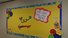 a bulletin board is decorated with buttons and magnets for kids to use on their school's bulletin boards