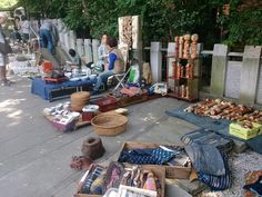 an outdoor market with various items on the ground