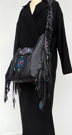 Black Handmade Crossbody Leather Bag. Native American inspired Handmade Leather Fringed Handbag. Genuine Leather. Crossbody or Shoulder Bag depend your mood !! Beautiful Ethnic Handbag with Fringes and Beads. Painted with Native American Symbols-Desings- embroidered with nice colors! Both side of the Bag are Fringed and decoraded with beats-(you can ad your personal charms if you want). I enjoy every moment creating this exceptional Bag. Become better with hard use. I wish that who ever purchase Artisan Leather Shoulder Bag For Festival, Artisan Hand-tooled Shoulder Bag For Festivals, Artisan Leather Festival Bags, Handmade Leather Festival Bag, Handmade Rectangular Hobo Bag For Festival, Handmade Black Bohemian Bags, Bohemian Hand-tooled Bags For Everyday Use, Bohemian Hand-stitched Tote Shoulder Bag, Traditional Hand Tooled Bag For Festivals