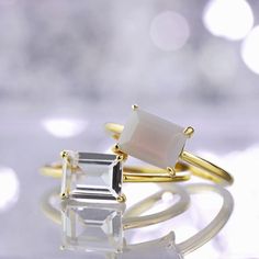 This minimal ring features a single rectangular cut Smokey Quartz stone with 4 prong setting. The ring is made in 925 Sterling Silver with 14K Gold Vermeil for a lasting shine. The clean lines and minimalist design makes this ring perfect for any occasion. Looks great on its own or staked with other rings.  This ring is available in whole sizes from 5 to 9 (US), and it is ready to ship. It comes elegantly packaged in our sleek signature box, ready for gifting or keeping!  (see images). This ring Minimalist Square Cut Solitaire Ring, Minimalist Solitaire Square Cut Ring, Minimalist Emerald Cut Crystal Gemstone Ring, Minimalist Stackable Rings With Rectangular Stone, Modern White Rectangular Rings, Minimalist 14k Gold Rings With Rectangular Stone, Minimalist 14k Gold Ring With Rectangular Stone, Rectangular Moonstone Ring For Anniversary, Minimalist Radiant Cut Ring As Gift