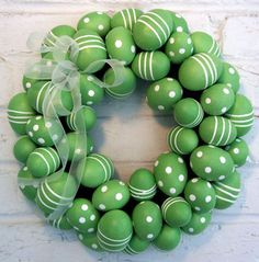 a green wreath with white polka dots on it