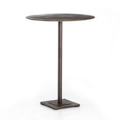 a round table with a metal base on an isolated white background for use as a side table