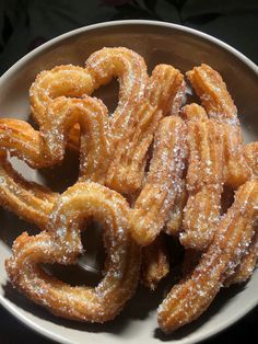 some sugar covered pretzels on a white plate