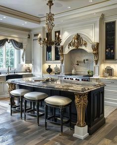 an elegant kitchen with marble counter tops and black cabinets, chandelier above the island