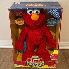 the sesame street elmo live plush toy is in its box